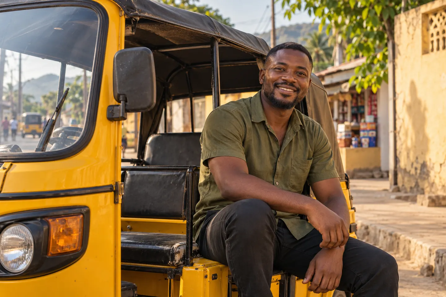 A smiling local Pragya driver ready for his next journey